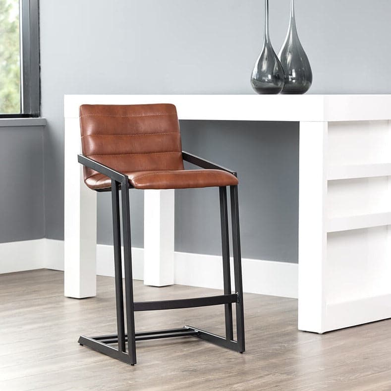 Webber Counter Stool, shown in cognac brown and matte black with leather, metal, and fixed arms.