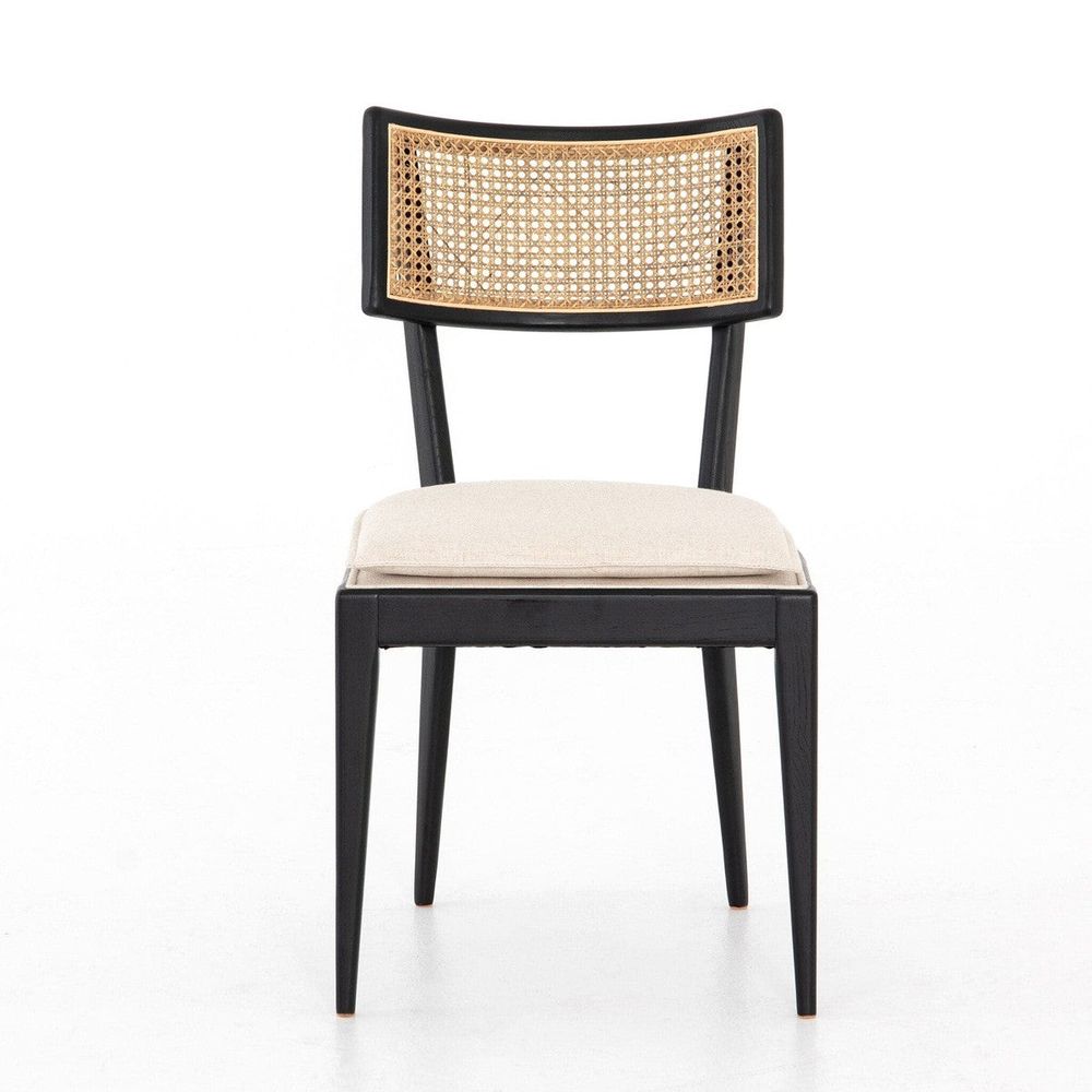 Talitha Dining Chair, shown in black and beige with wood, cane webbing, and armless.