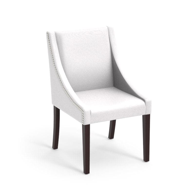 Lucille Dining Armchair, shown in off-white and ivory with upholstery, wood, and fixed low arms.