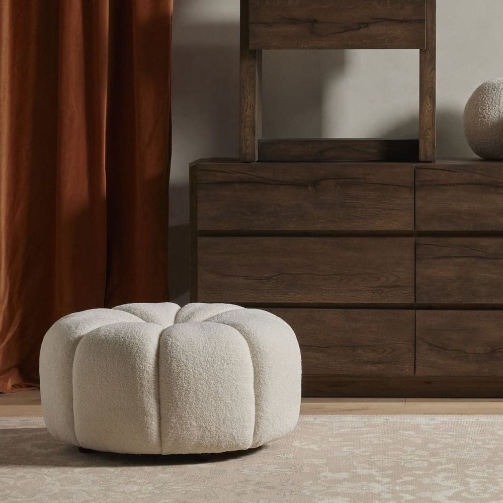 Additional view of Onyx Ottoman in cream and off-white, featuring matte black legs and low armless ottoman form.
