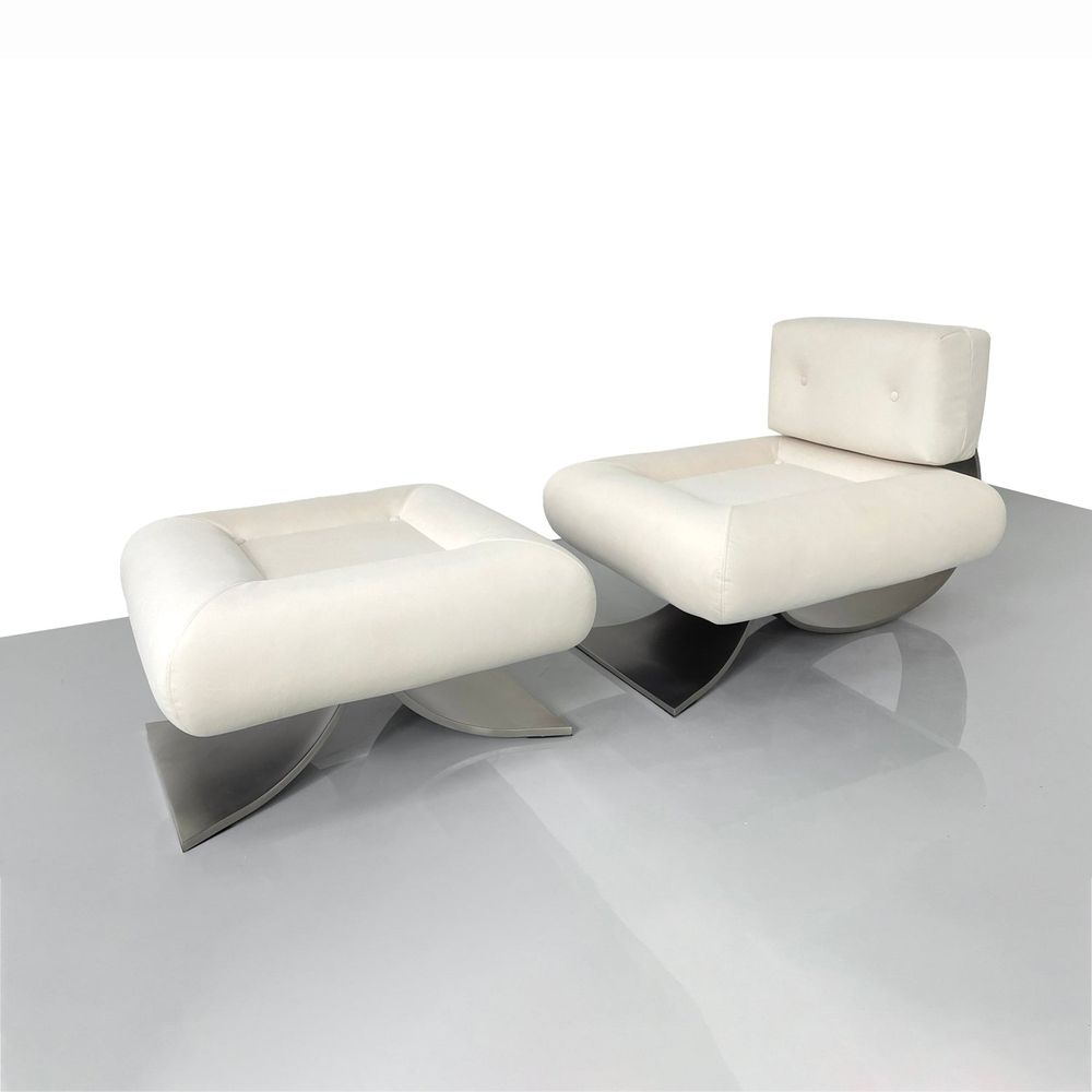 Niemeyer Lounge Chair and Ottoman, shown in ivory and cream with upholstery fabric, metal, and matching ottoman.