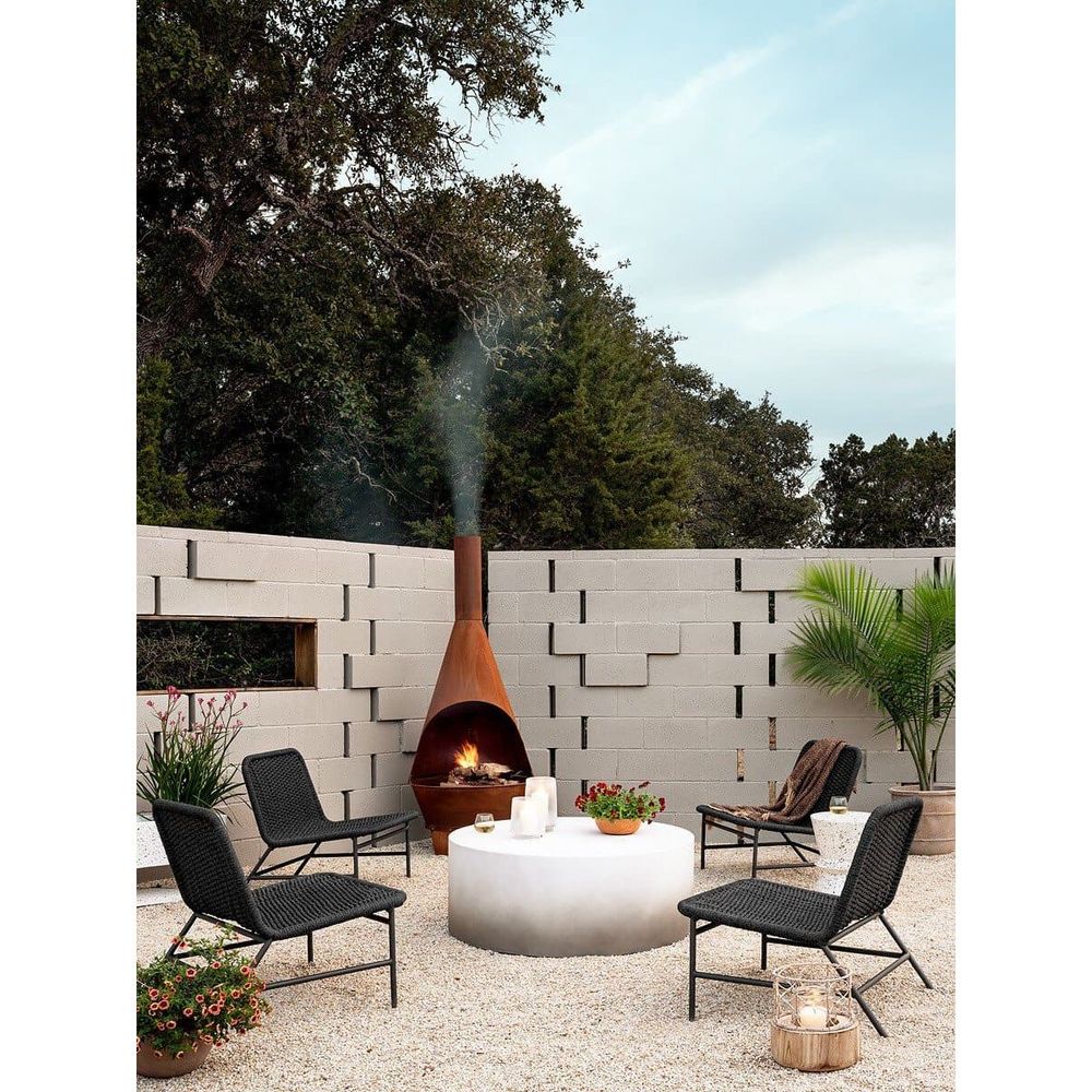Additional view of Louvre Outdoor Chair in dark grey and black, featuring armless open sides.