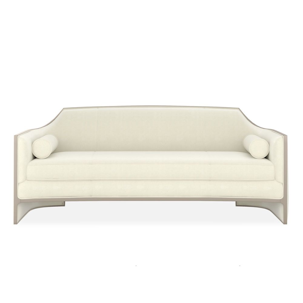 Mystique Sofa, shown in ivory and cream with fabric, wood, and fixed low arms.
