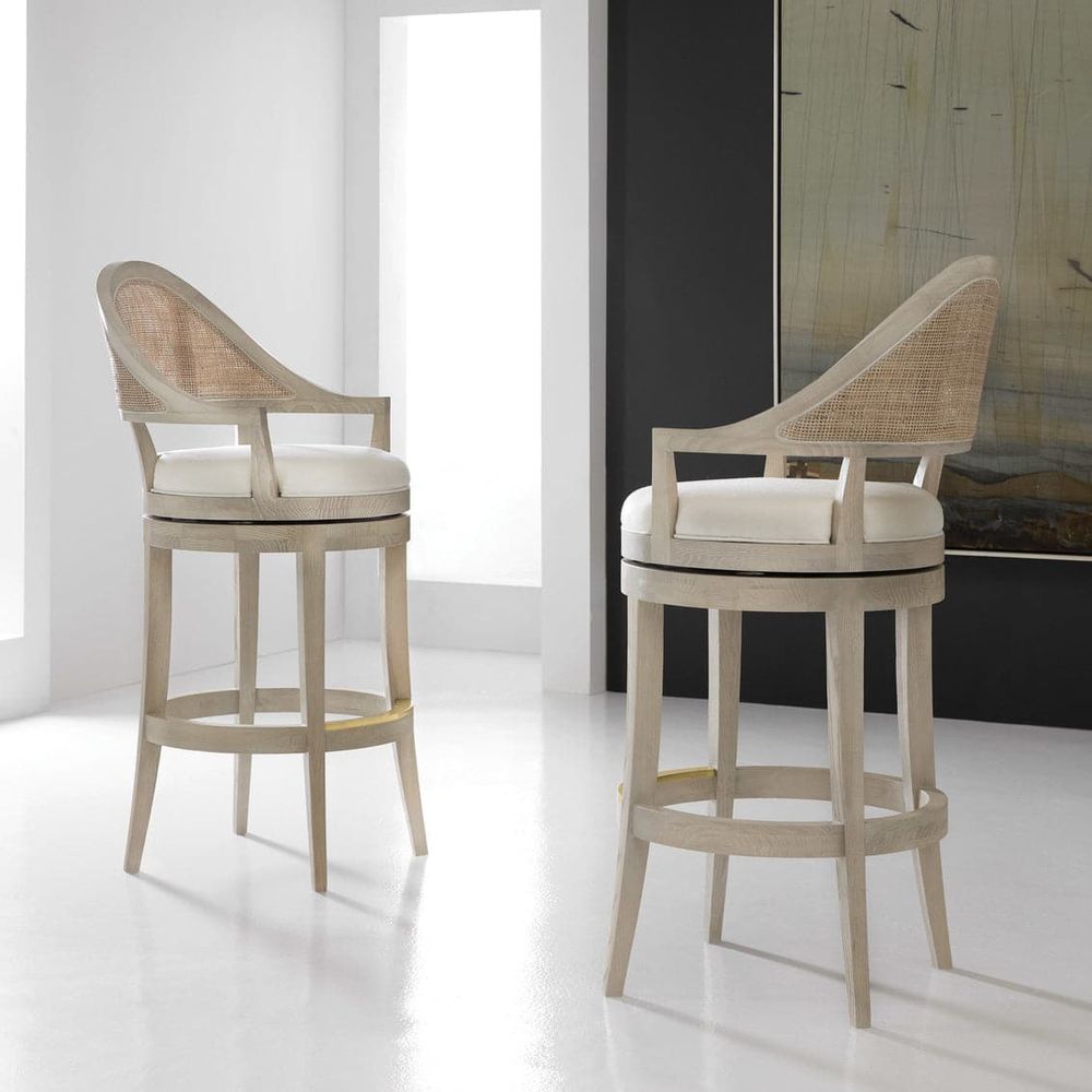 Lyon Counter & Bar Stool, shown in pale ash beige and ivory cream with wood, cane rattan, and swivel seat mechanism.