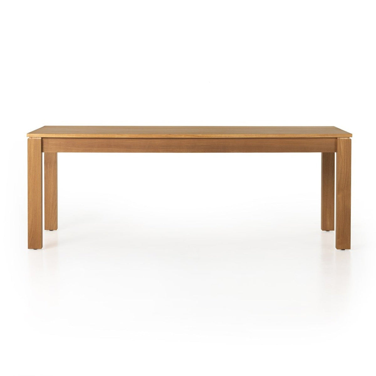 Front view of the Timur dining table showing its straight apron and Parsons-style legs