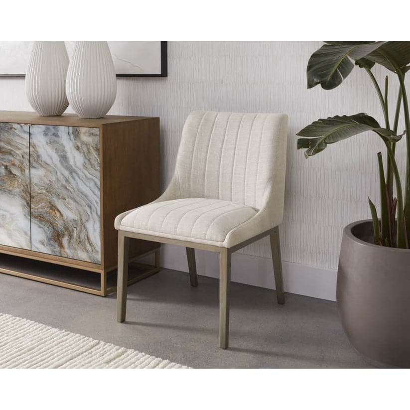 Additional view of Halden Dining Chair in beige and cream, featuring vertical channel tufting and armless.