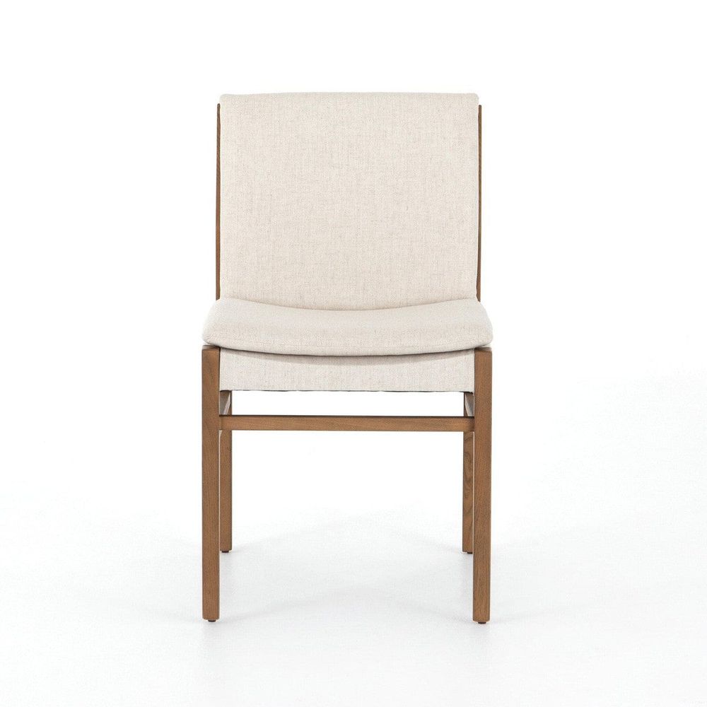 Nia Dining Chair, shown in beige and medium brown with fabric upholstery, wood frame, and armless open sides.