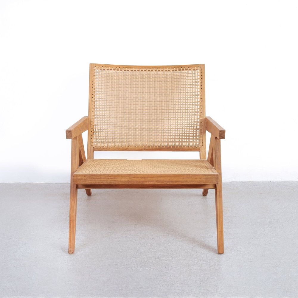 Jeanneret Lounge Chair with Arms and Hand Caned Seat with solid wood, cane rattan, and fixed arms.