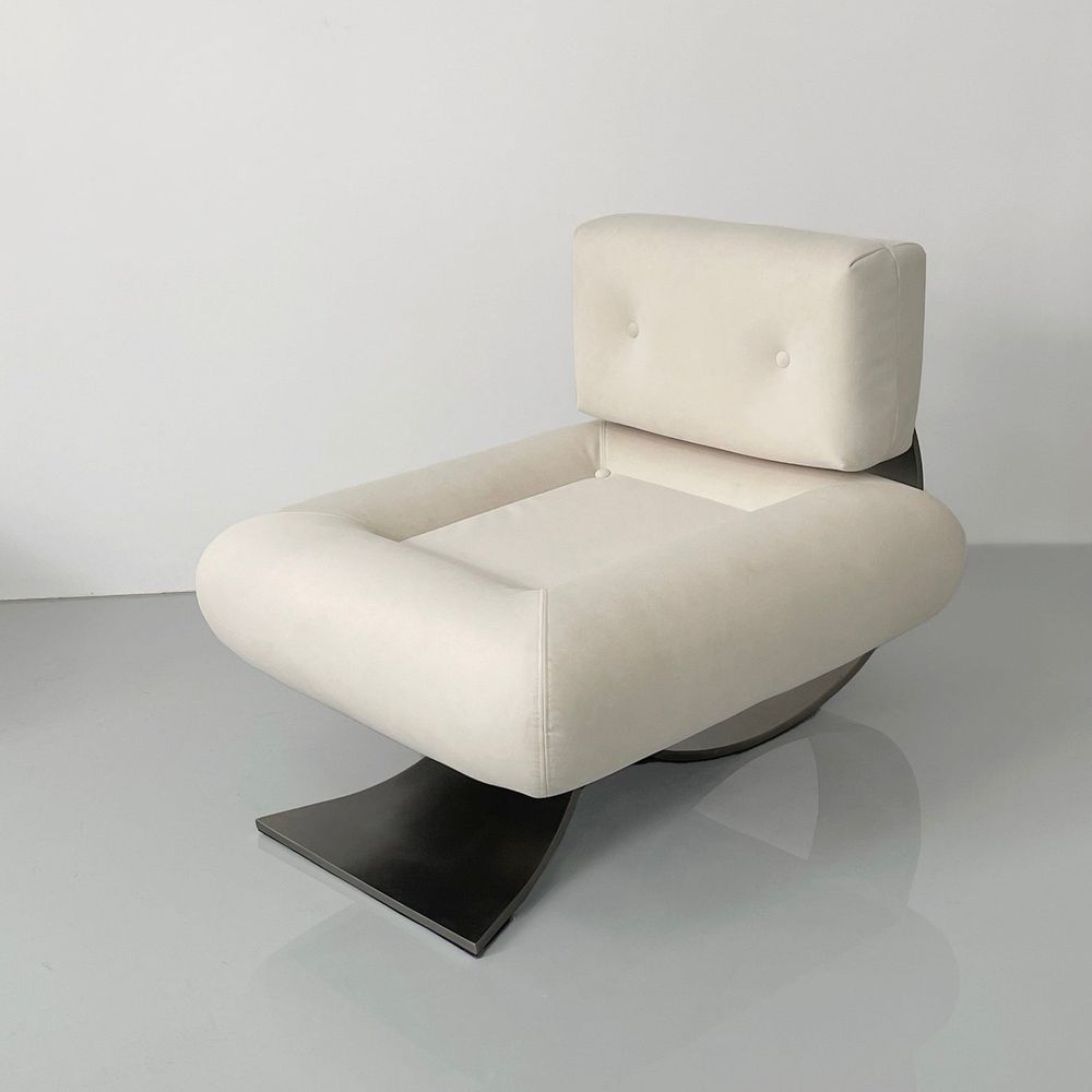 Additional view of Niemeyer Lounge Chair and Ottoman in ivory and cream, featuring matching ottoman.