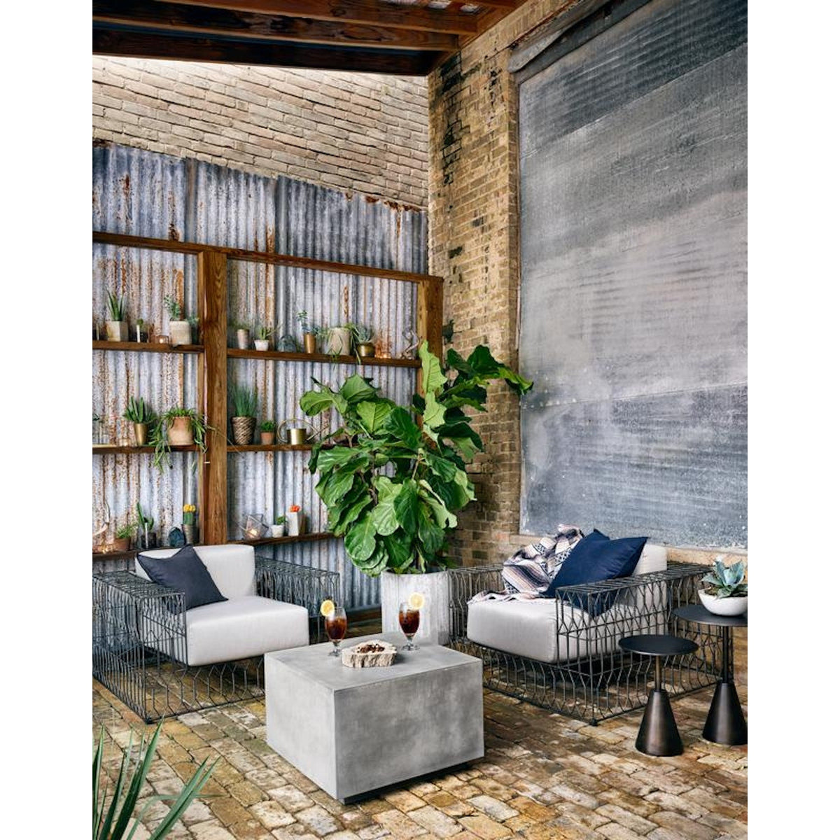 Four Hands Parish Concrete Cube coffee table in dark grey with a square top and recessed base